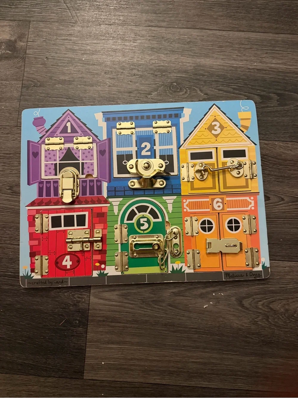 Melissa & Doug Colorful Lockboard - Rainbow Activity Puzzle